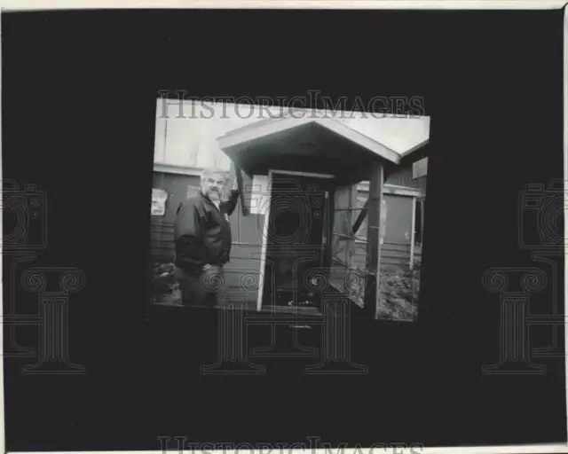 1991 Press Photo Man Standing on Front Porch of Home - afa47295