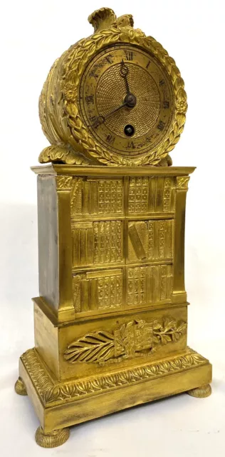 Stunning Antique Regency Gilt Bronze Clock Depicting A Bookshelf Silk Suspension