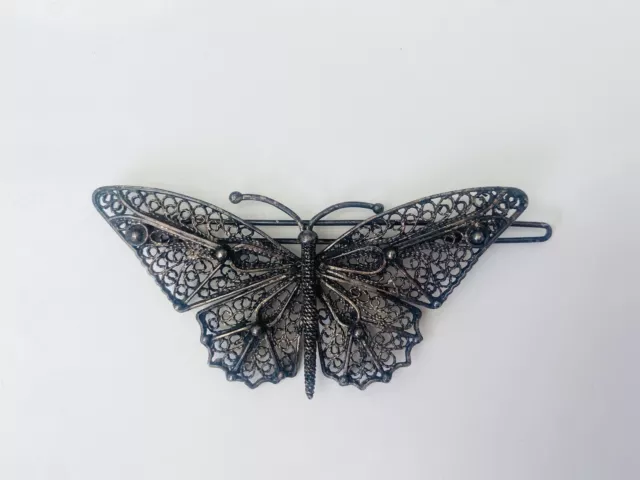 Barrette ornement à cheveux Art Déco stylisant un papillon en filigrane vintage
