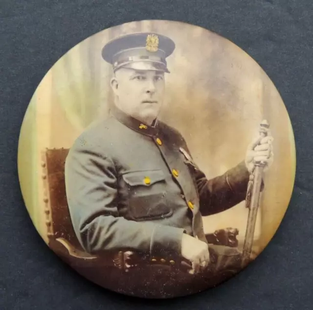 VINTAGE CELLULOID ADVERTISING POCKET MIRROR featuring a NEW YORK POLICE OFFICER