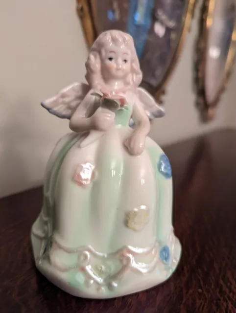 5.5" VINTAGE ANGEL  Bell IRIDESCENT FIGURINE W/ flower beautiful! Porcelain