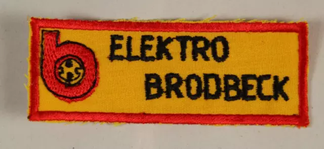 A19/ Elektro Brodbeck  älterer Aufnäher mit Reklame Beschriftung - 8,5x3 cm /214