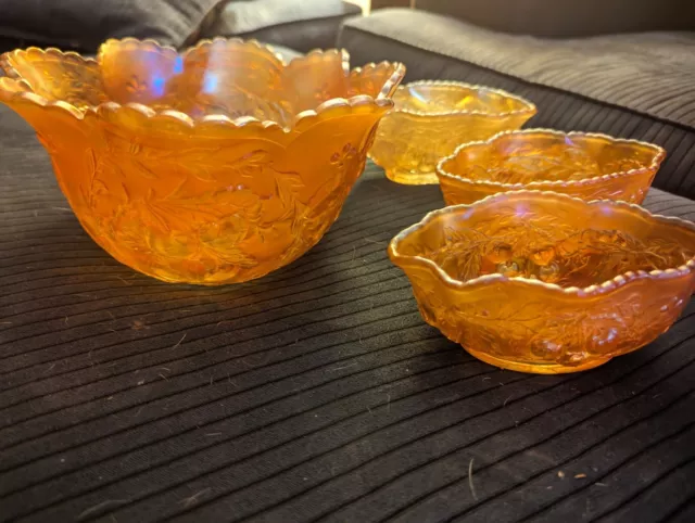 vintage carnival glass bowl with 3 smaller bowls