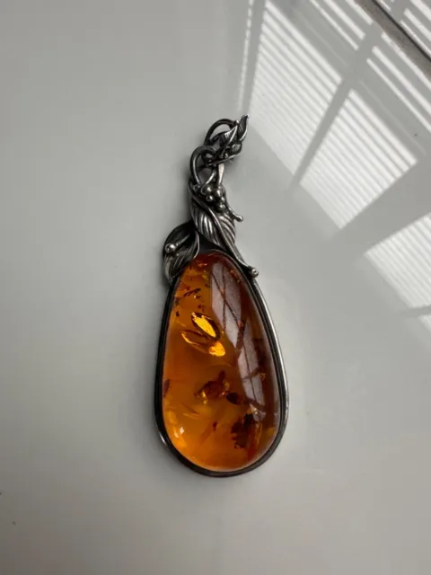 vintage amber pendant in good condition, no chain