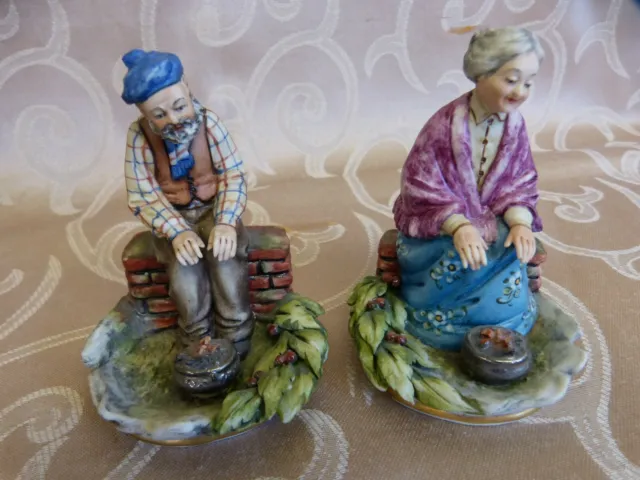 Capodimonte Figures of an old Man and Woman in front of campfires