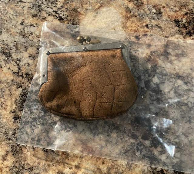 7 vintage coin purses leather and black ?silk? fasteners work.