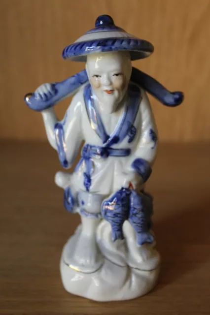 Vintage Oriental blue and white Chinese fisherman figurine