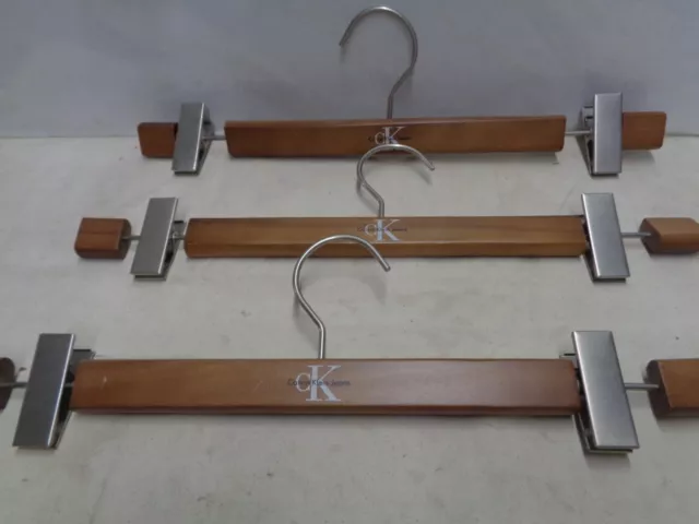 CK Calvin Klein Jeans 4 nice wooden hangers from NYC show room ? Fancy ornate