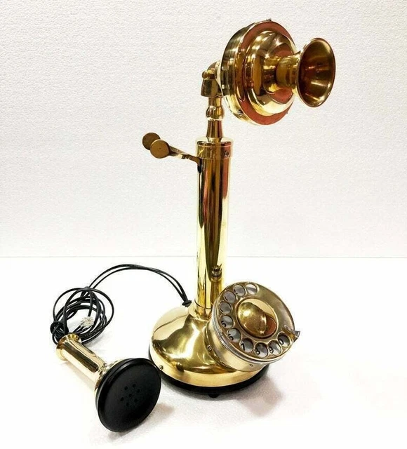 Candelabro vintage con esfera giratoria latón dorado teléfono fijo americano