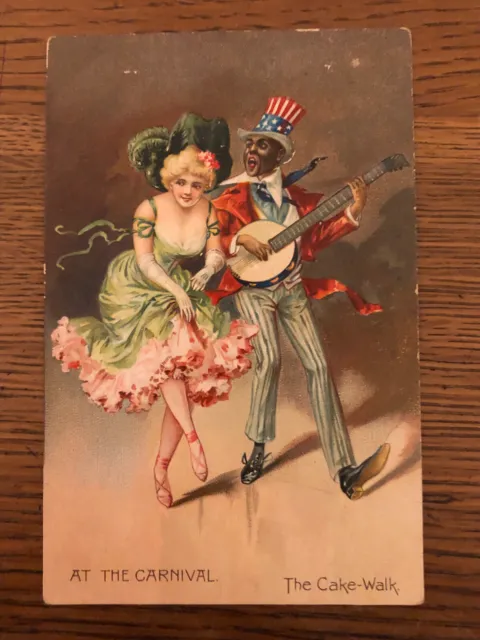 Black Americana Tuck's postcard "At the Carnival" minstrel with Uncle Sam hat