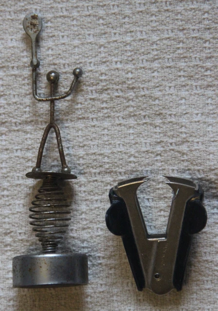 Vintage metal Tennis Racquet mounted on spring with heavy base