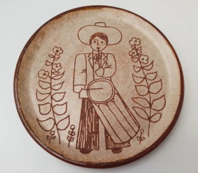 Assiette décorative en grès signée IVAN " joueur de tambour "