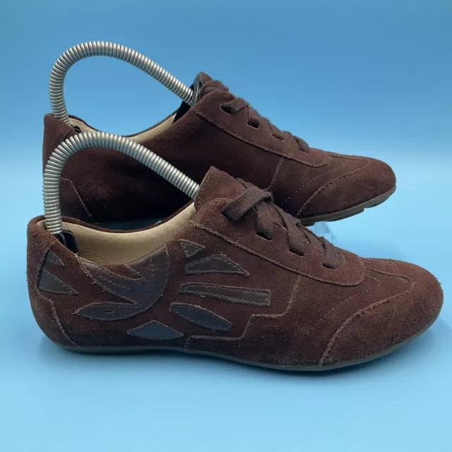 Clarks slip sales on trainers