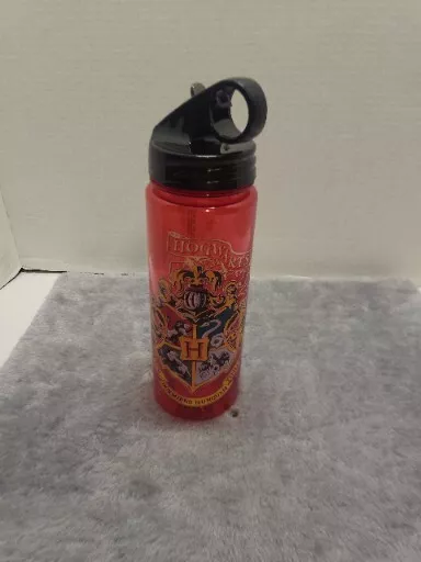 Silver Buffalo Harry Potter Movie 1-8 Shield with Flag Tritan Water Bottle,