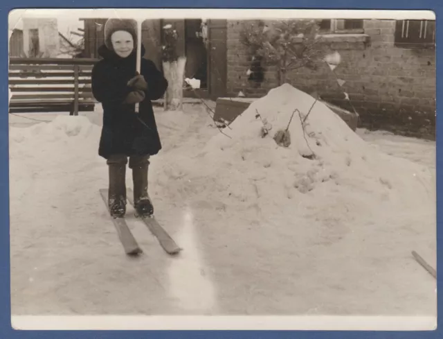 Beautiful boy skiing in the snow. Soviet Vintage Photo USSR