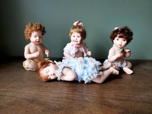 Lot of 4 Ashton-Drake Galleries Titus Tomescu Mini Porcelain Dolls