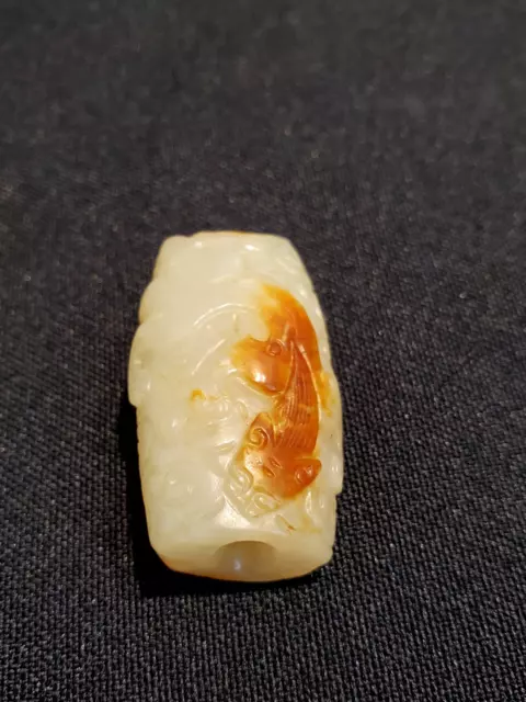 Ming，A Delicated hand-carved ”Chi-Long“ celadon jade pendant/ 明，螭龙纹红沁白玉勒子