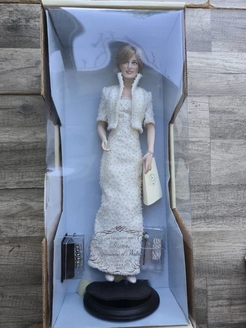 princess diana porcelain doll green dress The Danbury Mint Princess Diana in wedding dress 20 tall porcelain doll in excellent condition. No box but does have the original stand. $65.00 DM to claim