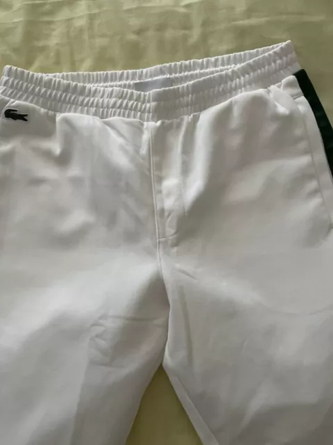 White lacoste guppy cheap