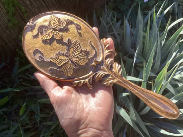 ancien miroir à main en résine dorée décor de papillons en relief
