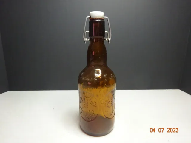 HOLLAND GROLSCH FLORIDA Embossed Amber Brown Glass Beer Bottle w/ Swing Top Cap
