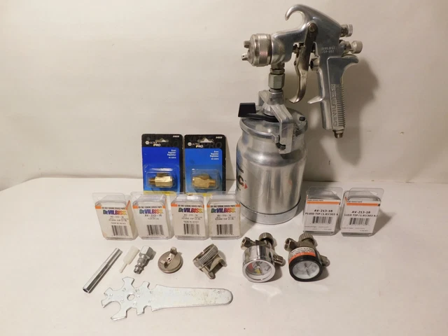 Devilbiss spray gun, 6 new Devilbiss nozzles, 2 Devilbiss guages, tools