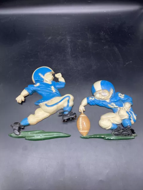 pair of vtg 1970's homco blue and white metal football players wall decor