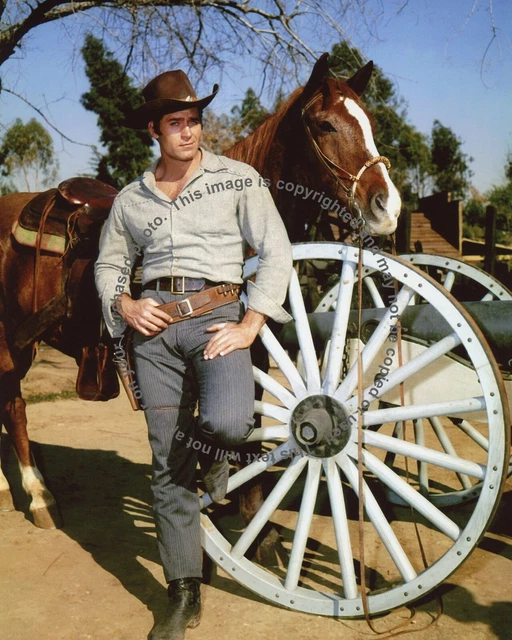 Clint Walker Posing by a Wagon