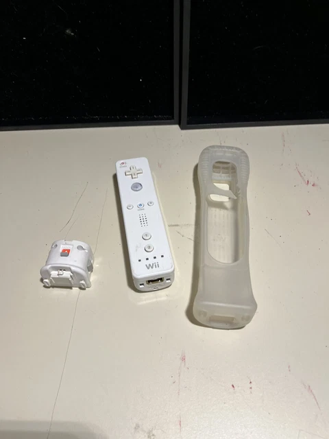Nintendo Wii Remote With Motion Plus Adapter and Grip.