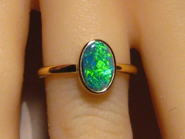 Black Opal Ring   ,      solid 18 k Yellow Gold  , Brightness 5
