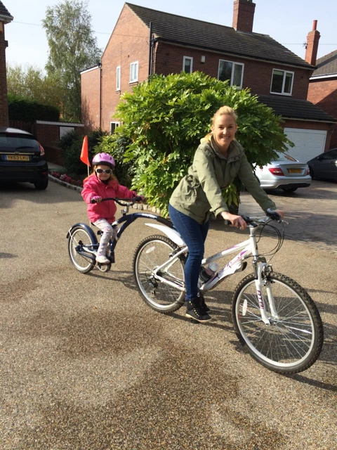Adams ride sales along bike