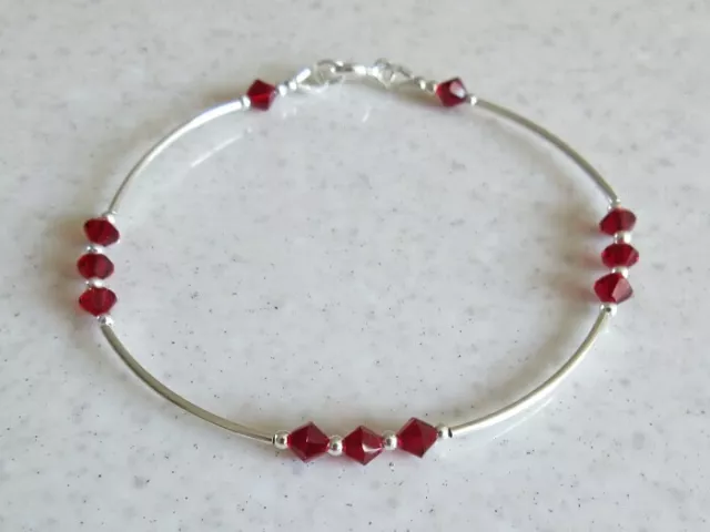 Elegant Sterling Silver Bangle Bracelet With Ruby Red Swarovski Crystals