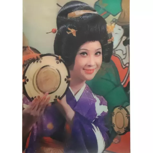 Geisha woman winking with drum - Vintage 3D Lenticular Postcard Greeting Card