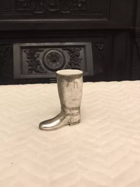 A vintage small  silver plated boot vase