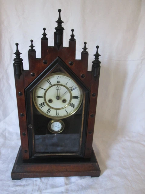 An Austrian / Black Forest Walnut Cathedral Shelf/Mantel Clock 30 Hour