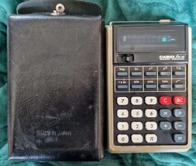 Vintage 1970s Casio FX-10 Scientific calculator working with case.