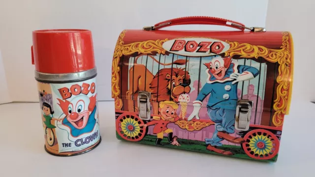 https://www.picclickimg.com/M9oAAOSwZQplLuw4/Vintage-1963-Bozo-the-Clown-Metal-Dome-Lunchbox.webp