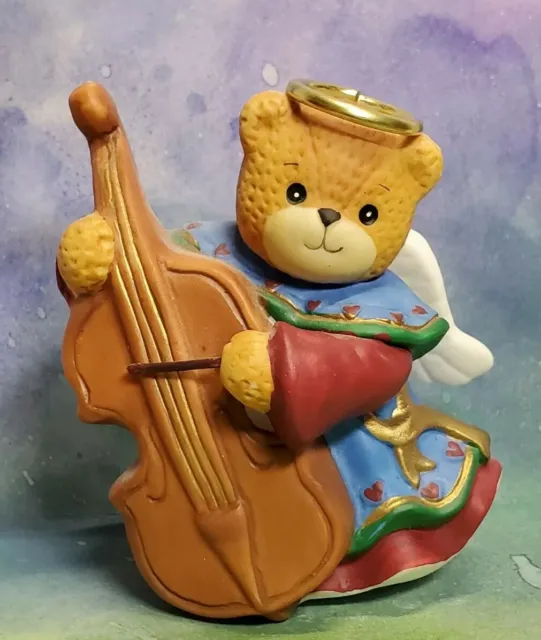 Enesco Lucy and Me Lucy Rigg Christmas Angel bear in maroon robe playing cello