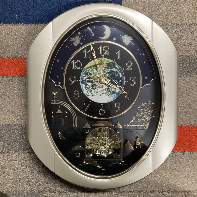 PEACEFUL COSMOS MELODIES Small World Rhythm Clock Magic In Motion 24