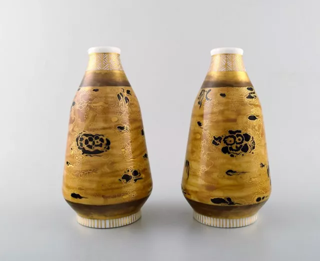 Theodor Larsen for Royal Copenhagen. A pair of porcelain vases decorated in gold