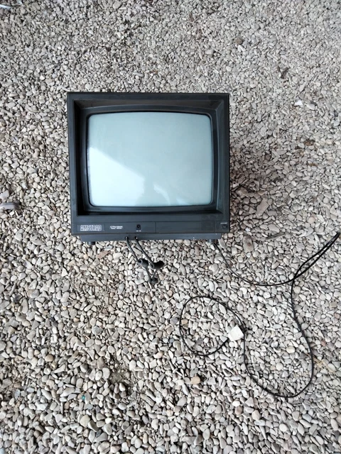 An Amstrad 128K personal computer together with a MP2 Amstrad module