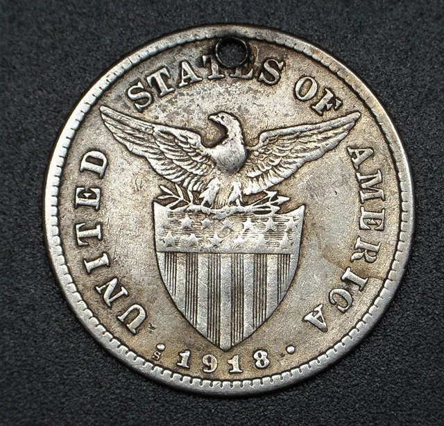 1918 US Philippines silver 20 Centavos. Small type. Holed.