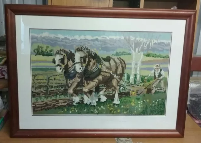 vitg framed completed tapestry  featuring 2 horses and a farmer plowing the soil