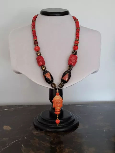 Unique artisan necklace with natural coral and handcrafted pendant