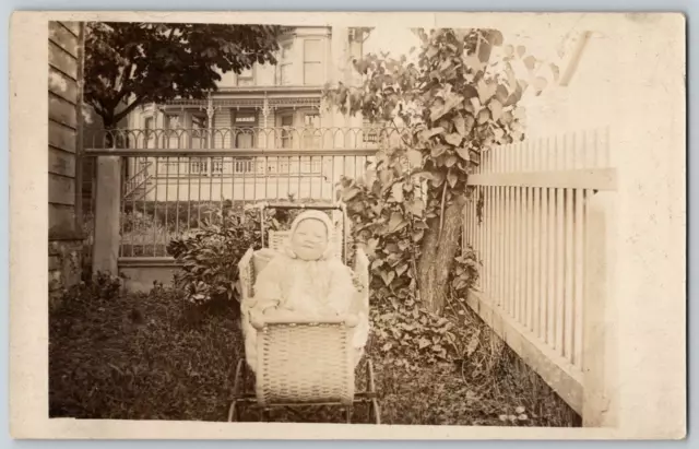 RPPC Postcard~ Infant Smirking In A Stroller In Lawn