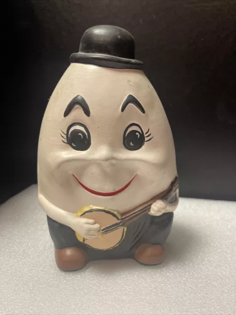 Banco de monedas vintage de cerámica Humpty Dumpty tocando  Banjo - sombrero sonriendo ojos grandes