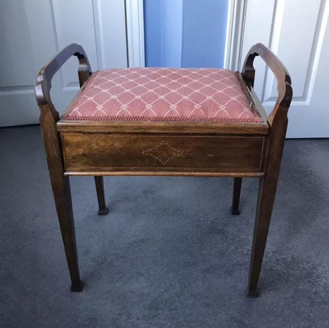 Beautiful reupholstered vintage wooden piano stool handles storage under seat