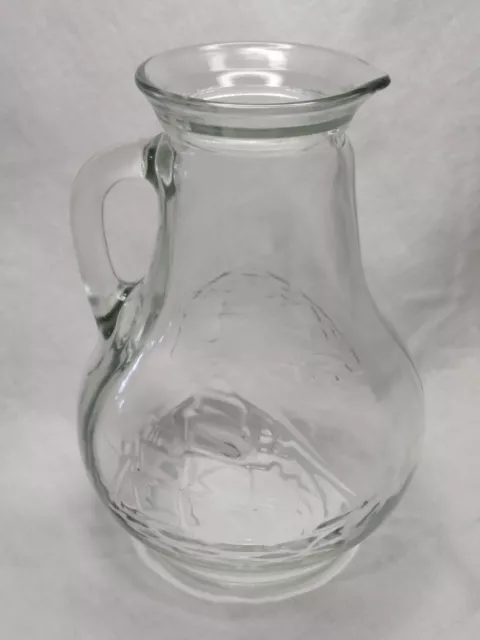 https://www.picclickimg.com/MRsAAOSwjFpkurWa/Vintage-Clear-Glass-28-oz-Pitcher-With-Handle.webp