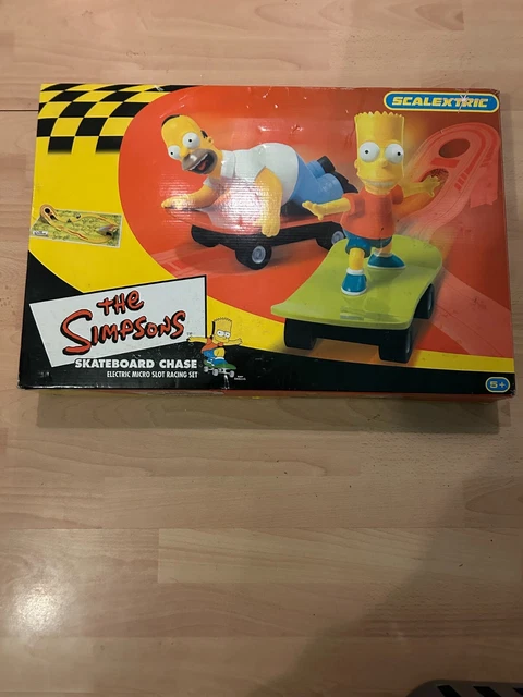 The Simpsons Skateboard Chase Homer and Bart Scalextric Micro Slot Racing Set.