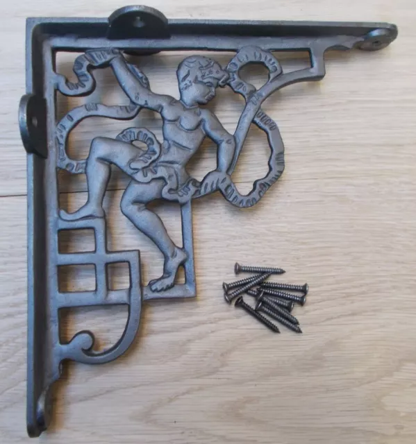 PAIR OF CHERUB ANTIQUE IRON  cast iron rustic shelf support wall brackets